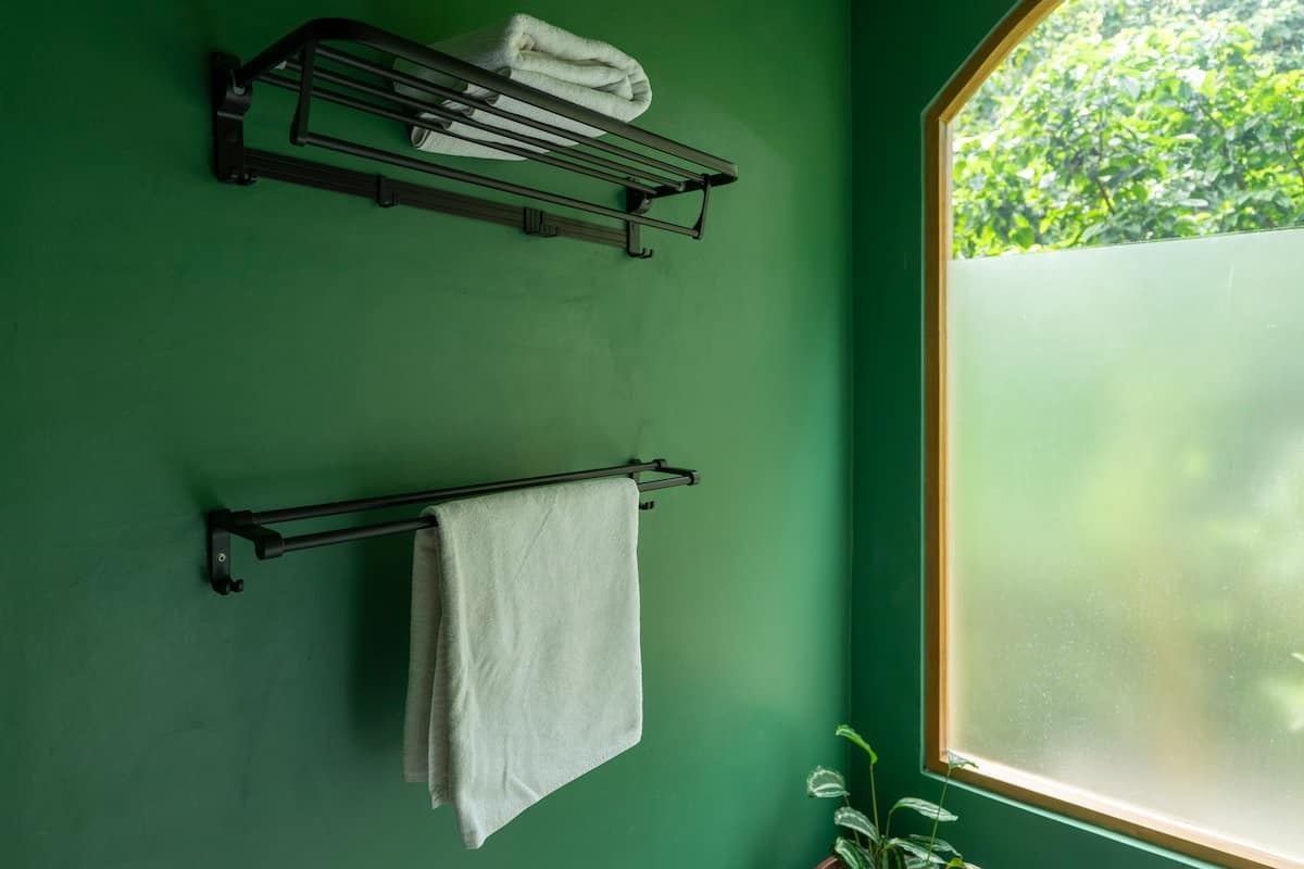 Towel rack and frosted window in the bathroom