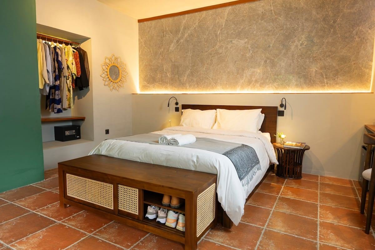 The bed and open wardrobe
