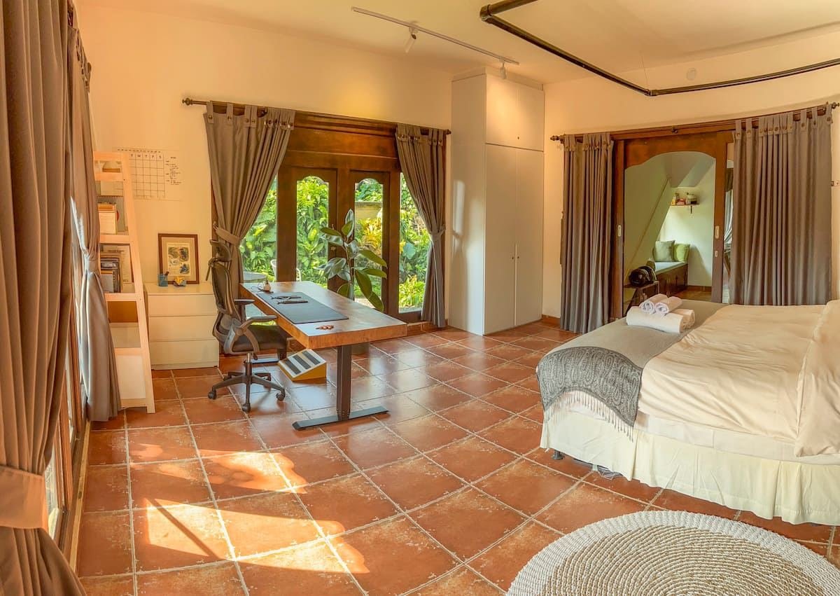 The bedroom, with glass doors onto the garden side
