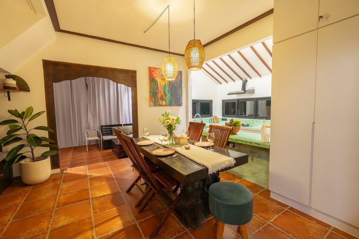 Dining table between the kitchen and the living room